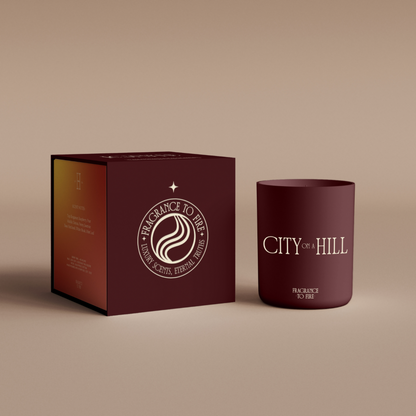 Maroon City on a Hill candle, zesty citrus scent for energy, visibility, and confidence.
