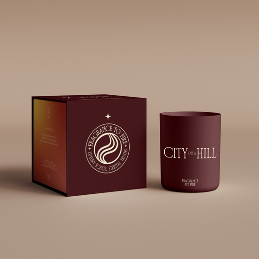Maroon City on a Hill candle, zesty citrus scent for energy, visibility, and confidence.