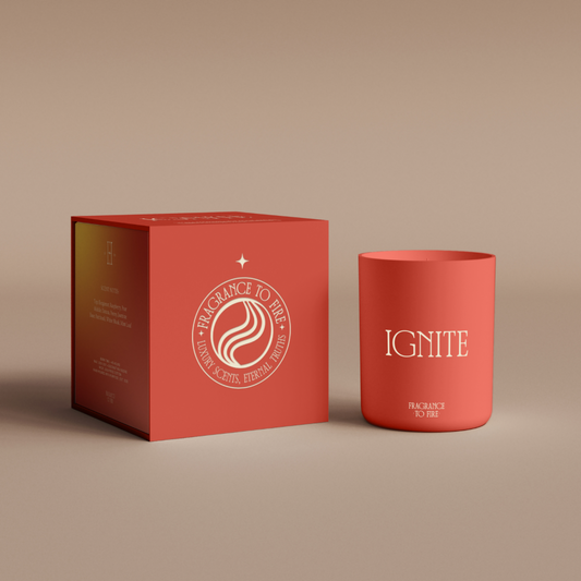 Red Ignite soy candle burning on a coaster, bold faith-inspired home fragrance with saffron scent.